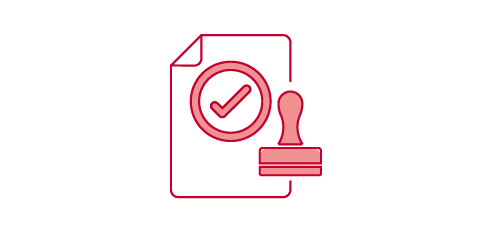 Two people sitting at a table, with a checkmark above them.