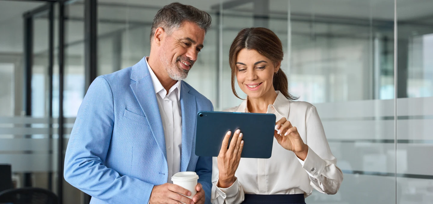 Workers reading on a tablet